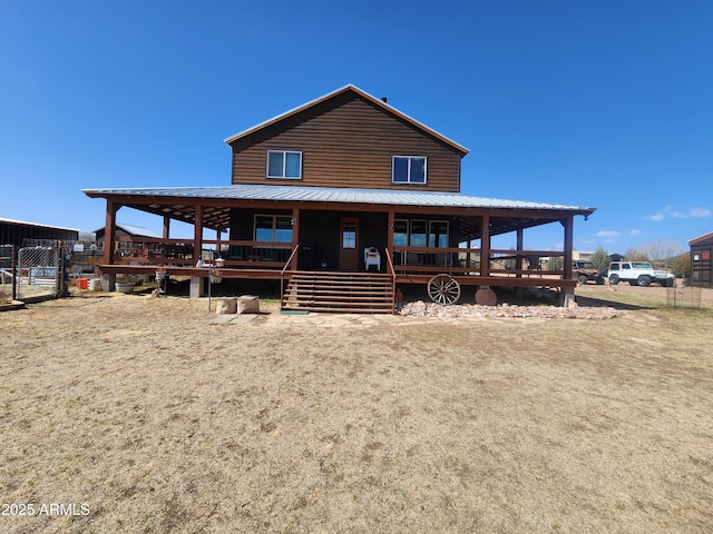 view of front of house featuring a porch and metal roof