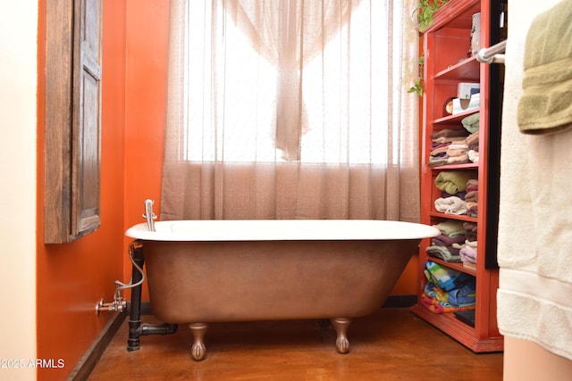 full bathroom with a freestanding tub