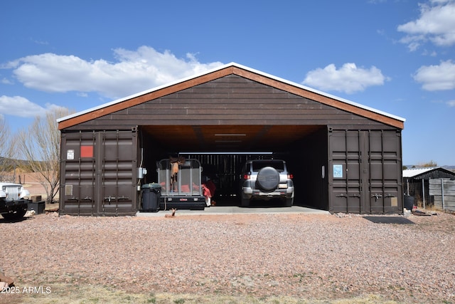 view of outdoor structure featuring driveway