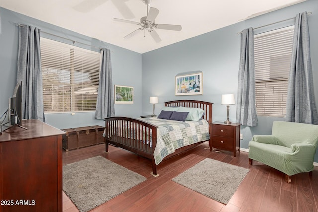 bedroom with a ceiling fan and wood finished floors