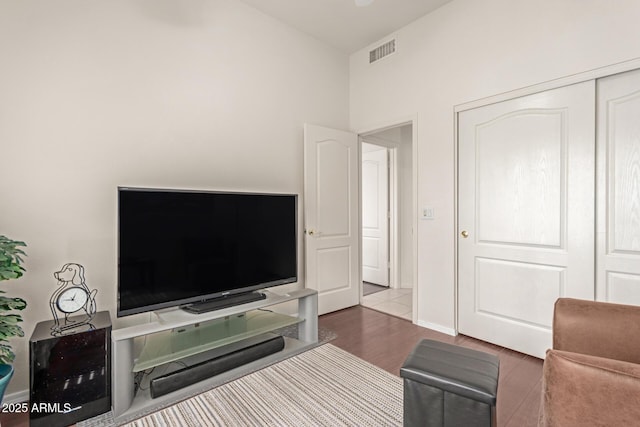 living room featuring wood finished floors and visible vents