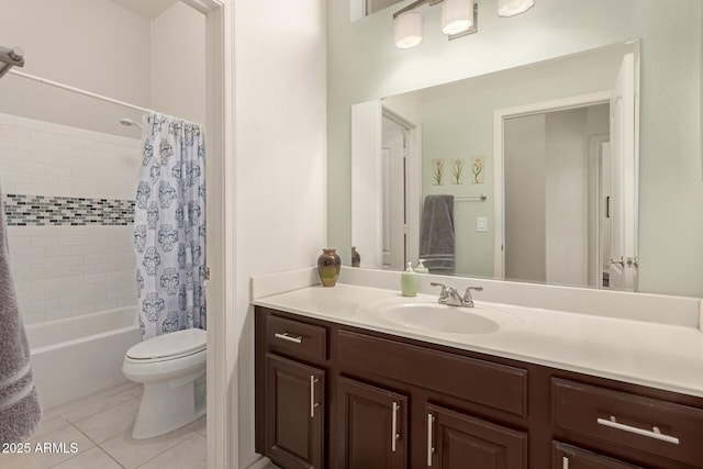 bathroom with tile patterned flooring, toilet, vanity, and shower / bath combo with shower curtain