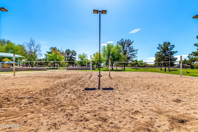 view of home's community featuring volleyball court