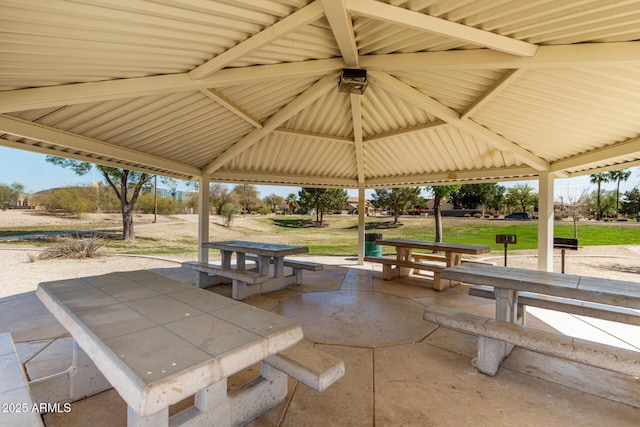 exterior space with outdoor dining space, a gazebo, a yard, and a patio area