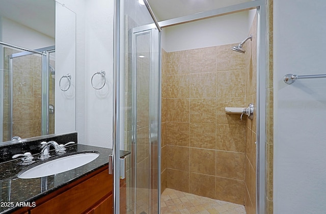full bath featuring a stall shower and vanity