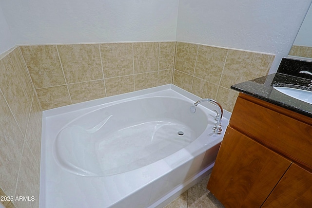 full bathroom with a bath and vanity