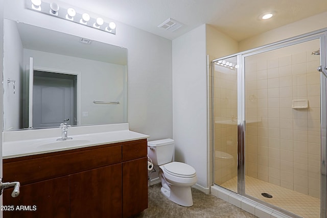 bathroom with toilet, a shower stall, vanity, recessed lighting, and tile patterned flooring