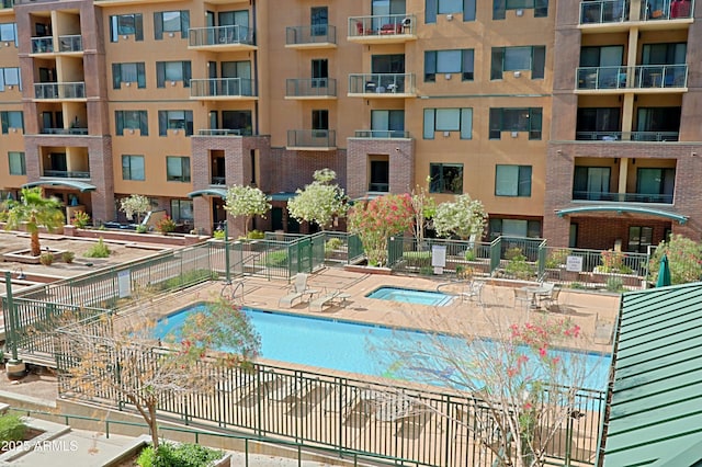 community pool featuring fence