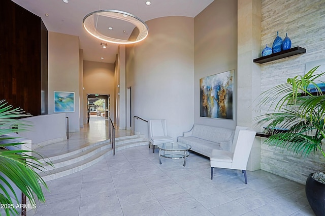building lobby with a towering ceiling and recessed lighting