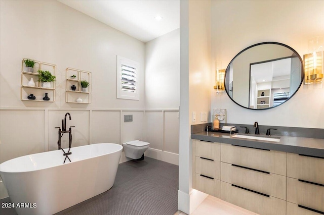 bathroom featuring toilet, vaulted ceiling, tile patterned floors, a bathing tub, and vanity