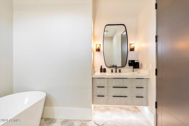 bathroom featuring a washtub and vanity