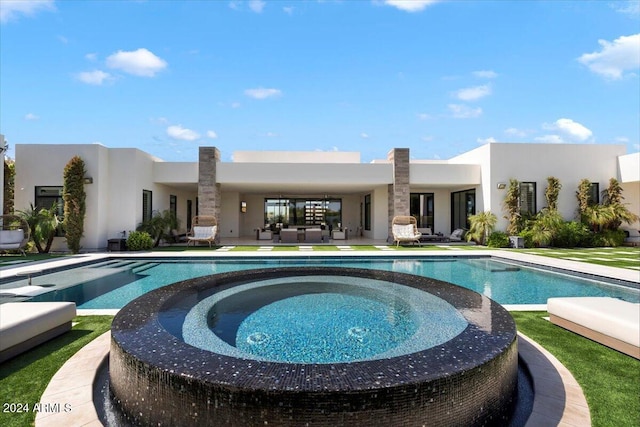 view of pool featuring an in ground hot tub and a patio