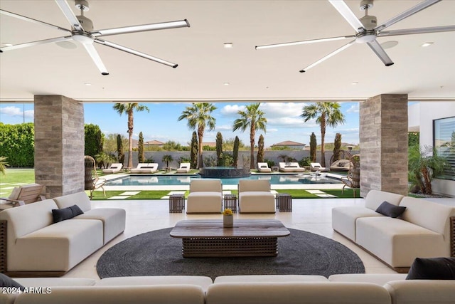 view of patio / terrace with ceiling fan, a fenced in pool, and an outdoor hangout area