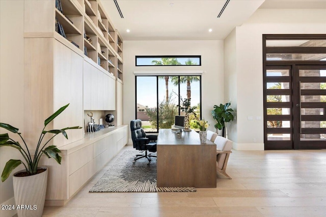 office space with light hardwood / wood-style flooring