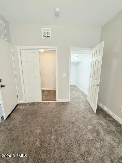 unfurnished bedroom with carpet flooring