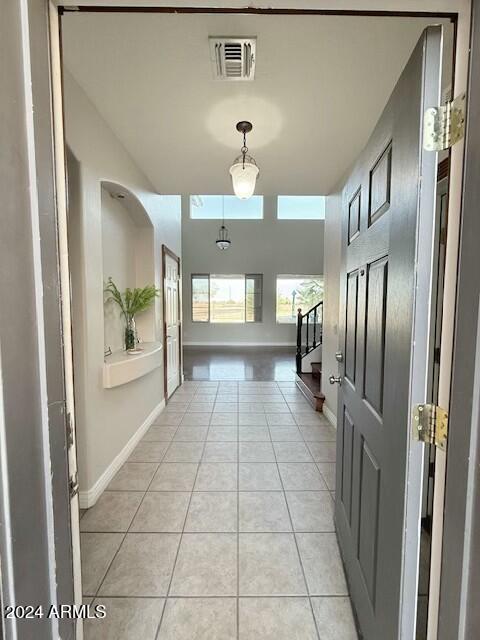 hallway with light tile patterned floors