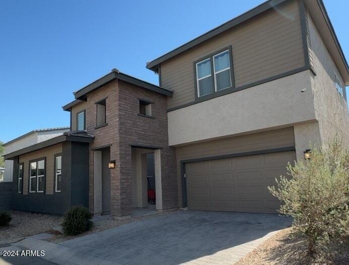 view of front of home with a garage