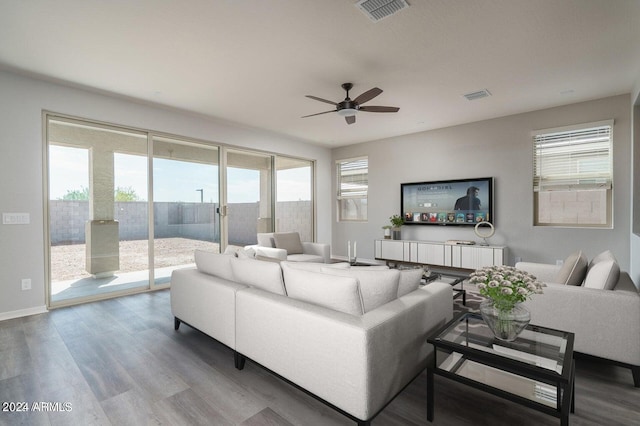 living room with ceiling fan and hardwood / wood-style floors