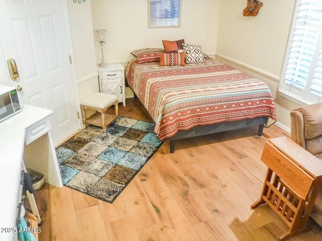 bedroom featuring hardwood / wood-style floors