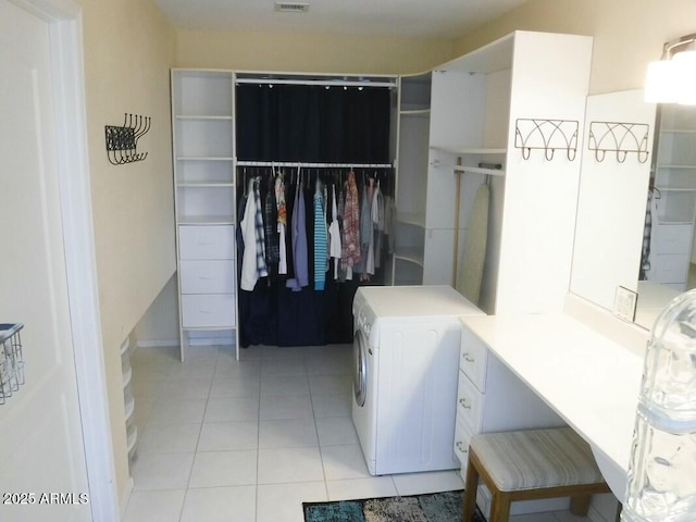 interior space featuring washer / clothes dryer and light tile patterned flooring