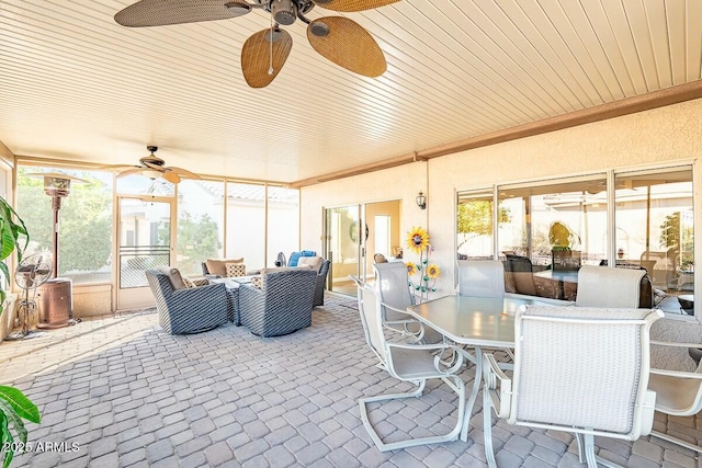 sunroom / solarium with ceiling fan