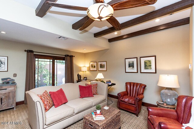 carpeted living room with beamed ceiling and ceiling fan