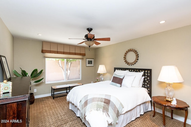 carpeted bedroom with ceiling fan