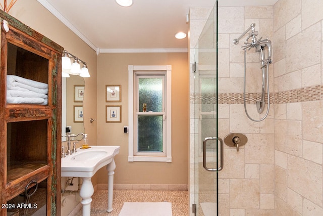 bathroom featuring an enclosed shower and crown molding