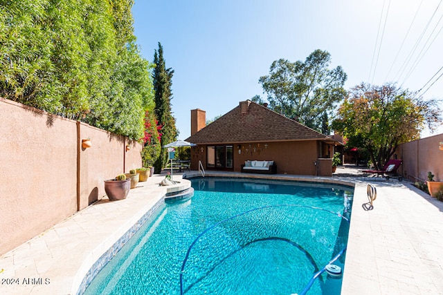 view of pool featuring a patio