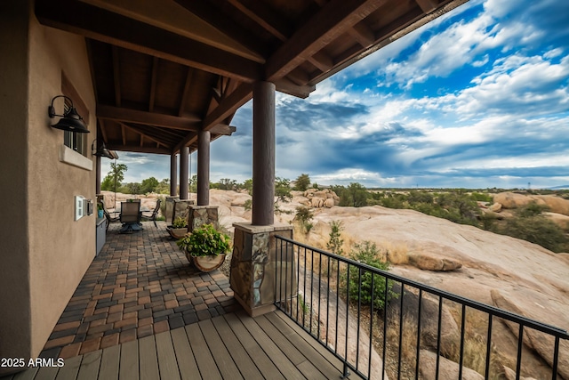 deck with outdoor dining area