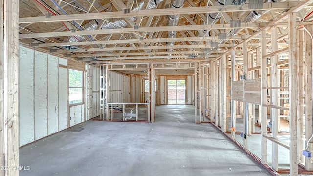 misc room featuring concrete flooring and a wealth of natural light
