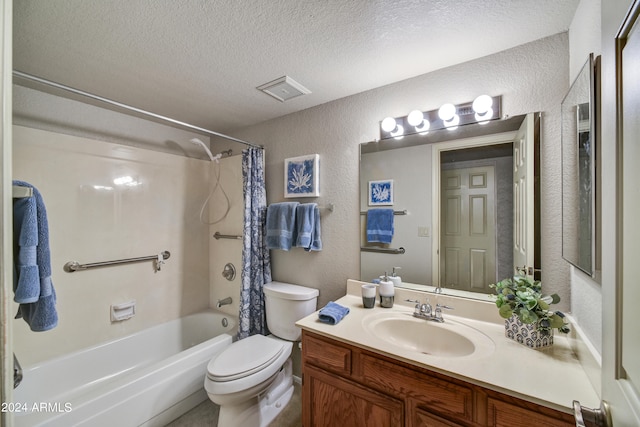 full bathroom with a textured ceiling, shower / bath combo with shower curtain, vanity, and toilet