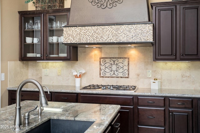 12904 W Dale Ln, Peoria, AZ 85383 - kitchen featuring a sink, stainless steel gas cooktop, dark brown cabinetry, and custom exhaust hood