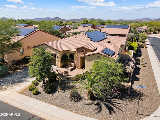 12904 W Dale Ln, Peoria, AZ 85383 - mediterranean / spanish house with stucco siding, a tile roof, a mountain view, and a residential view