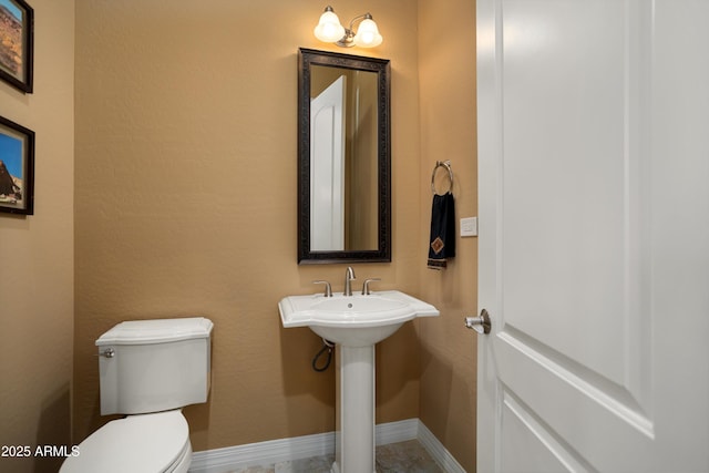 12904 W Dale Ln, Peoria, AZ 85383 - half bathroom with toilet and baseboards