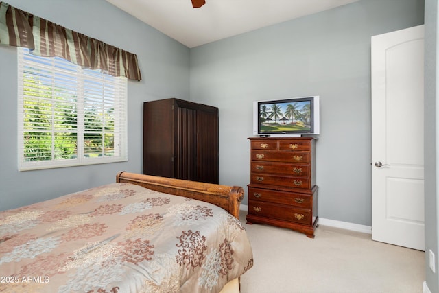 12904 W Dale Ln, Peoria, AZ 85383 - bedroom with light colored carpet, ceiling fan, and baseboards