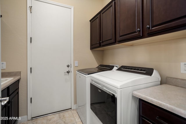 12904 W Dale Ln, Peoria, AZ 85383 - washroom featuring cabinet space, washing machine and dryer, and baseboards