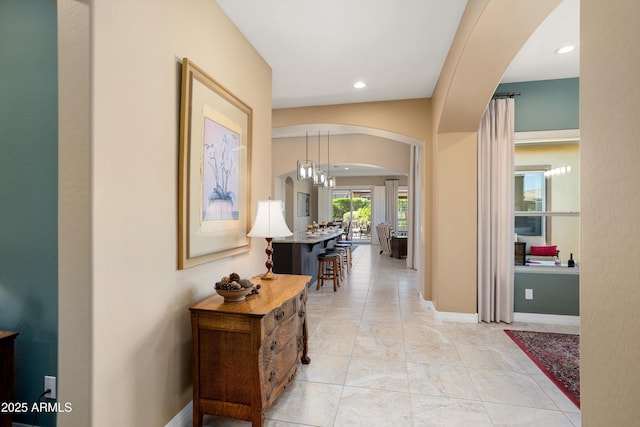 12904 W Dale Ln, Peoria, AZ 85383 - hallway with arched walkways, recessed lighting, and baseboards