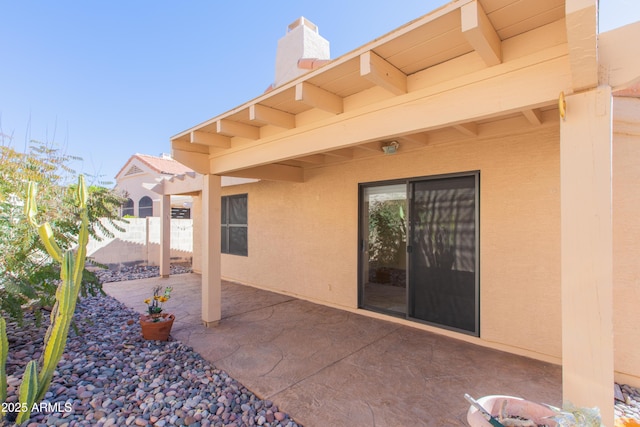 view of patio / terrace featuring fence