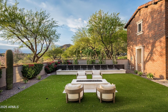 view of yard with a fire pit