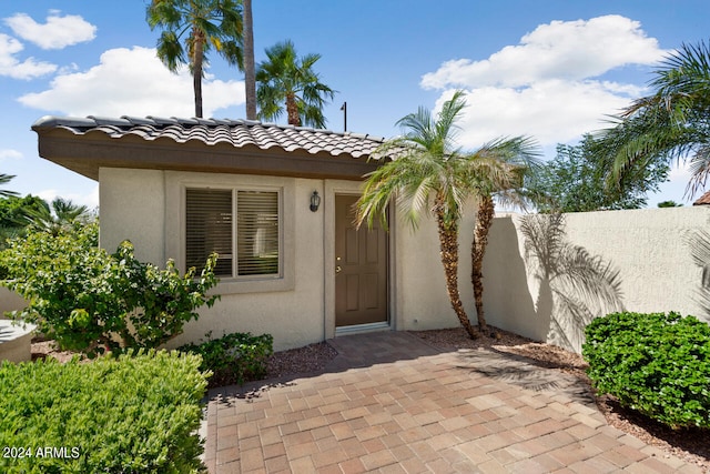 property entrance with a patio area