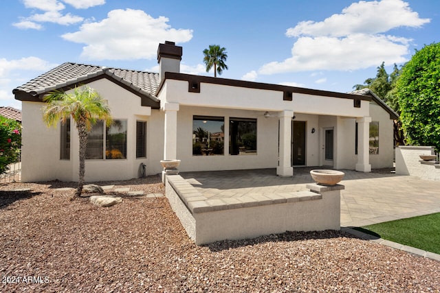 back of house with a patio area