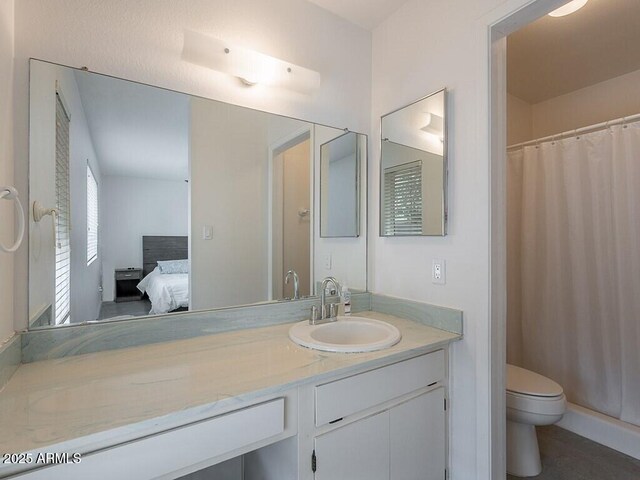 5817 S Siesta Ln, Tempe, AZ 85283 - bathroom with ensuite bathroom, toilet, vanity, and a shower with shower curtain