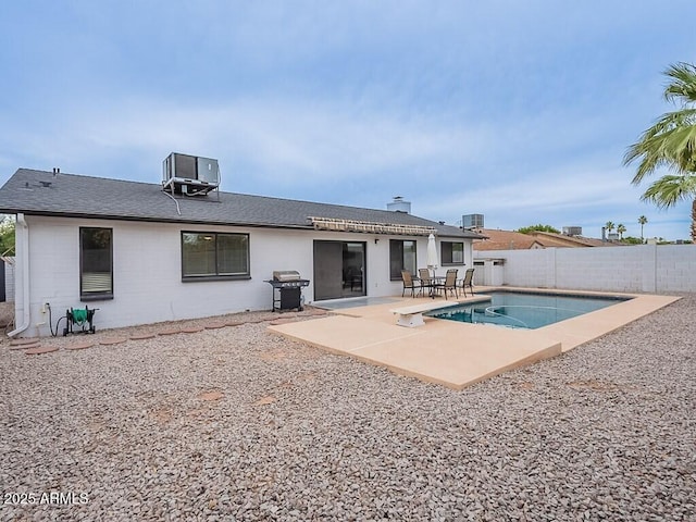 5817 S Siesta Ln, Tempe, AZ 85283 - back of house with cooling unit, a patio area, a fenced backyard, concrete block siding, and a shingled roof