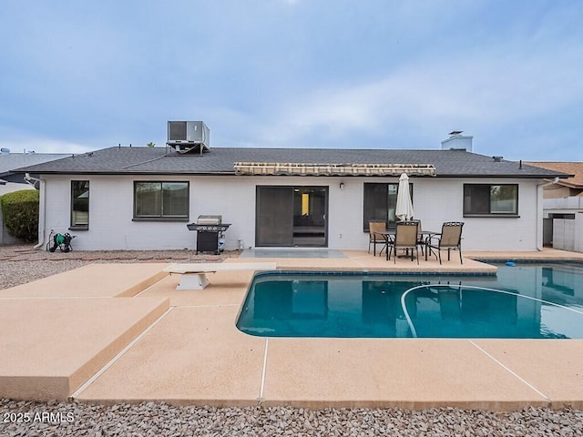 5817 S Siesta Ln, Tempe, AZ 85283 - back of property with a patio, central air condition unit, an outdoor pool, and roof with shingles