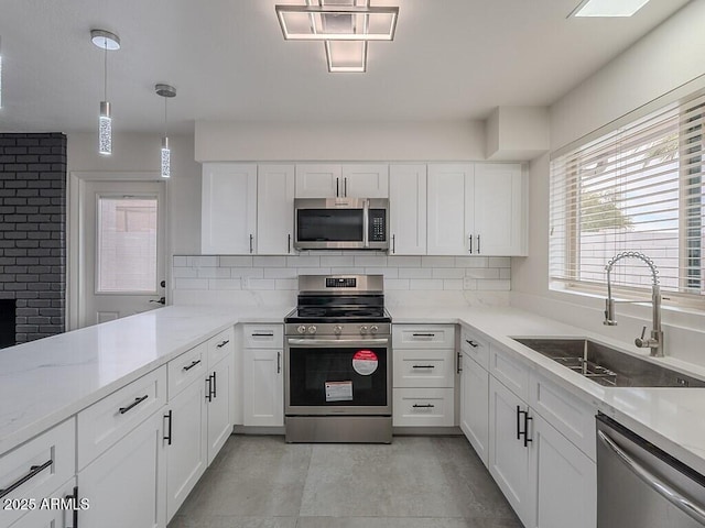 5817 S Siesta Ln, Tempe, AZ 85283 - kitchen featuring appliances with stainless steel finishes, a sink, tasteful backsplash, and white cabinetry
