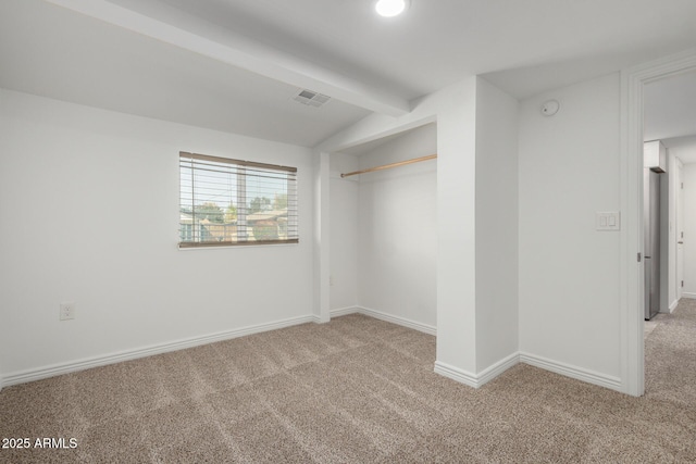 unfurnished room featuring vaulted ceiling with beams, carpet flooring, visible vents, and baseboards