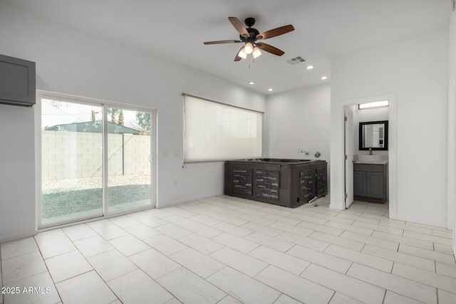 unfurnished bedroom featuring recessed lighting, a sink, visible vents, baseboards, and access to outside