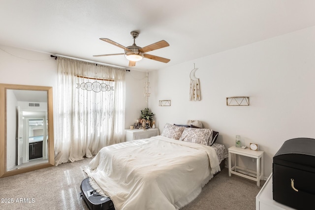 bedroom with carpet floors, visible vents, and a ceiling fan