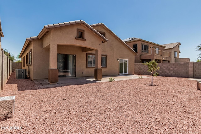 9224 W Raymond St, Tolleson, AZ 85353 - rear view of property featuring stucco siding, a patio area, and a fenced backyard